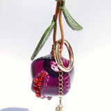 Charm de piel granada burdeos