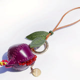 Charm de piel granada burdeos
