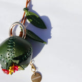 Charm de piel granada verde
