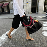 Le Sac XL negro flecos